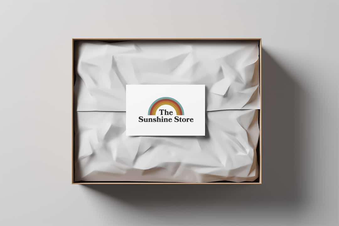 Open gift box with white wrapping paper and business card on a light background. Business gift. Mock up. Top view. 3d rendering