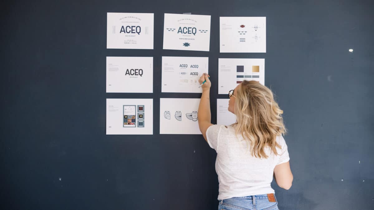 Photo of Design Director, Jordis Small, working on the brand guide for a client in Stellen Design Blog: What is Brand Strategy by Jordis Small.