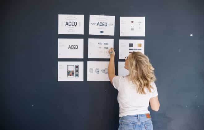 Photo of Design Director, Jordis Small, working on the brand guide for a client in Stellen Design Blog: What is Brand Strategy by Jordis Small.