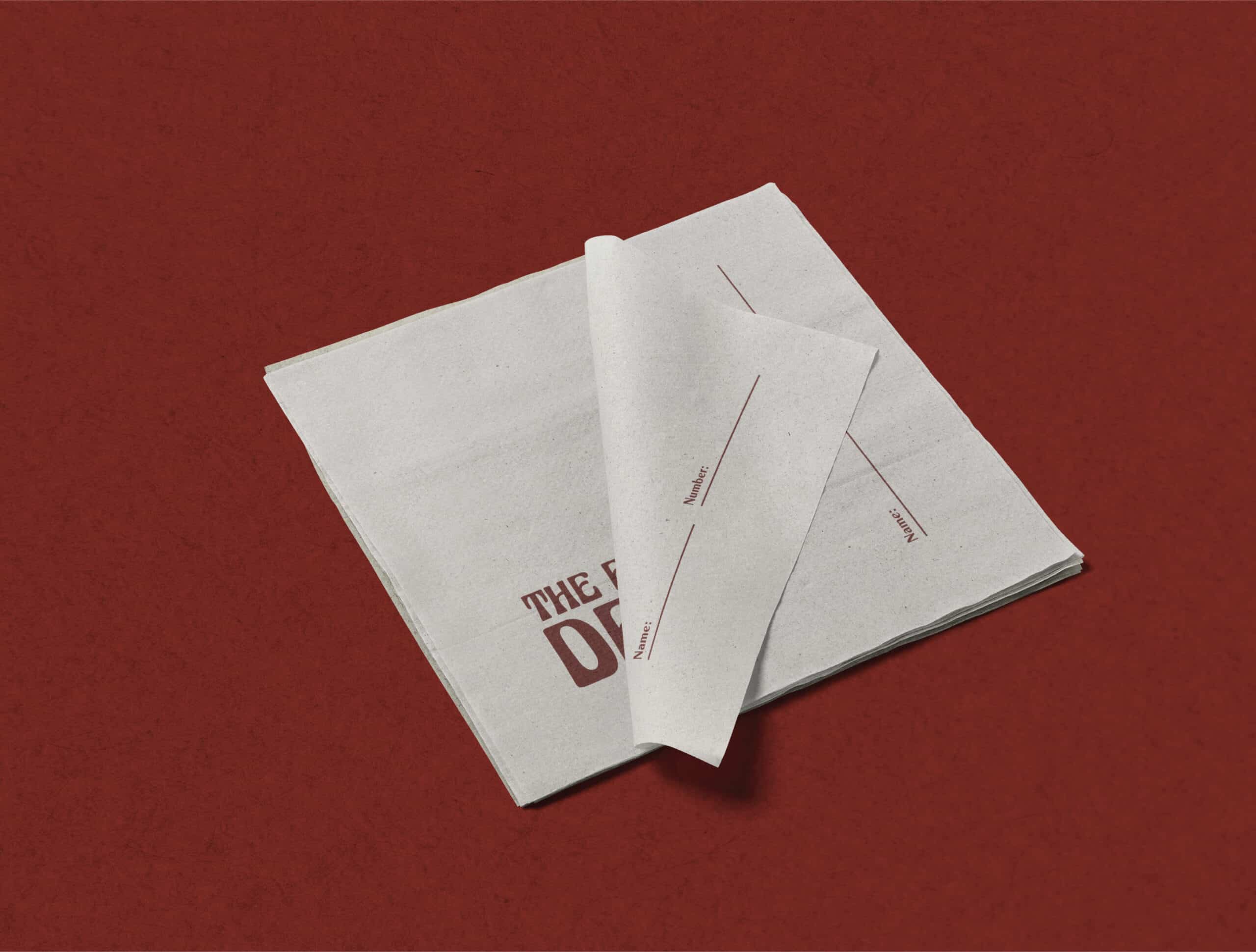 Custom cocktail napkins with The Fox Den logo, a subtle yet effective element of their bar branding in Redondo Beach.