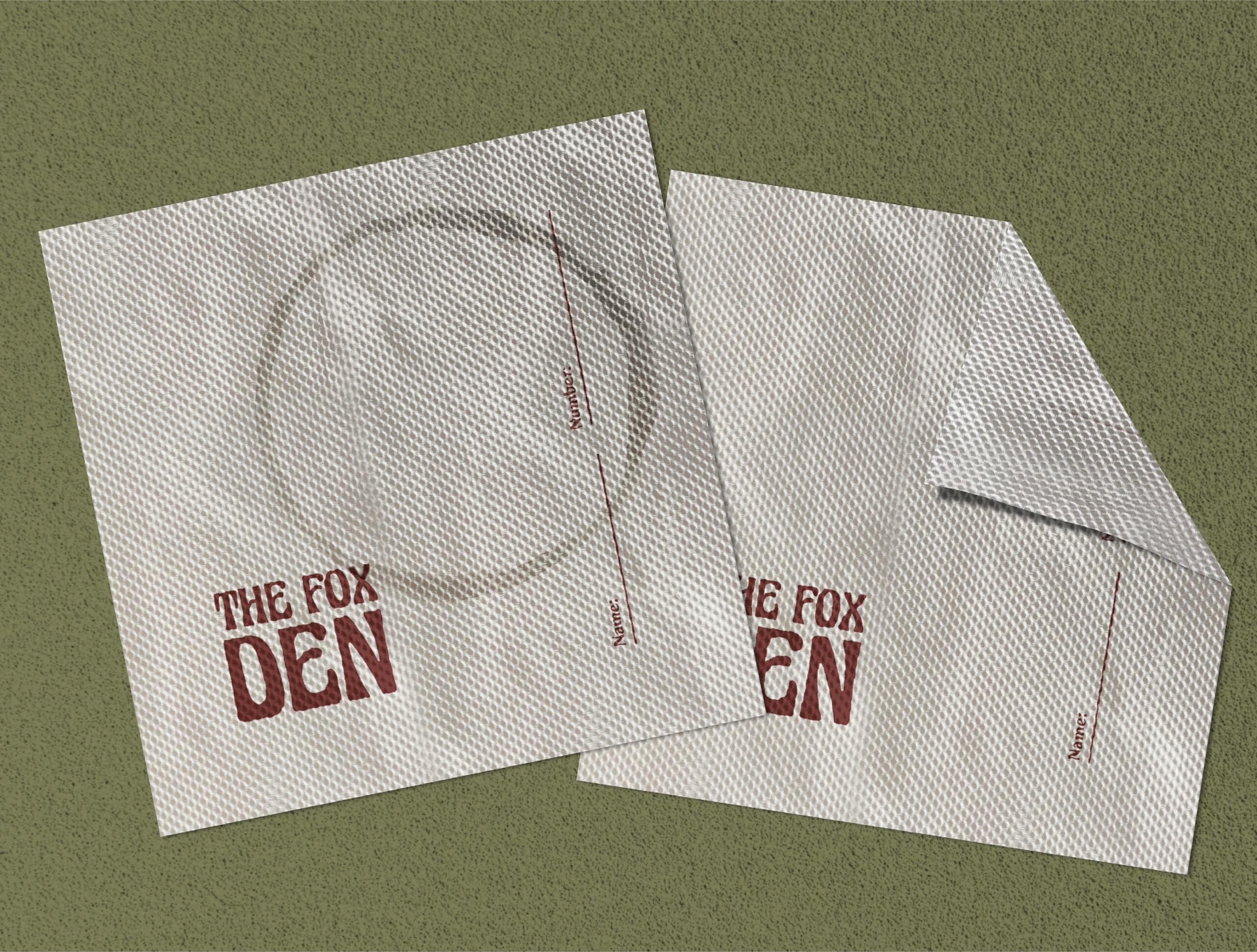 Custom cocktail napkins with The Fox Den logo, a subtle yet effective element of their bar branding in Redondo Beach.