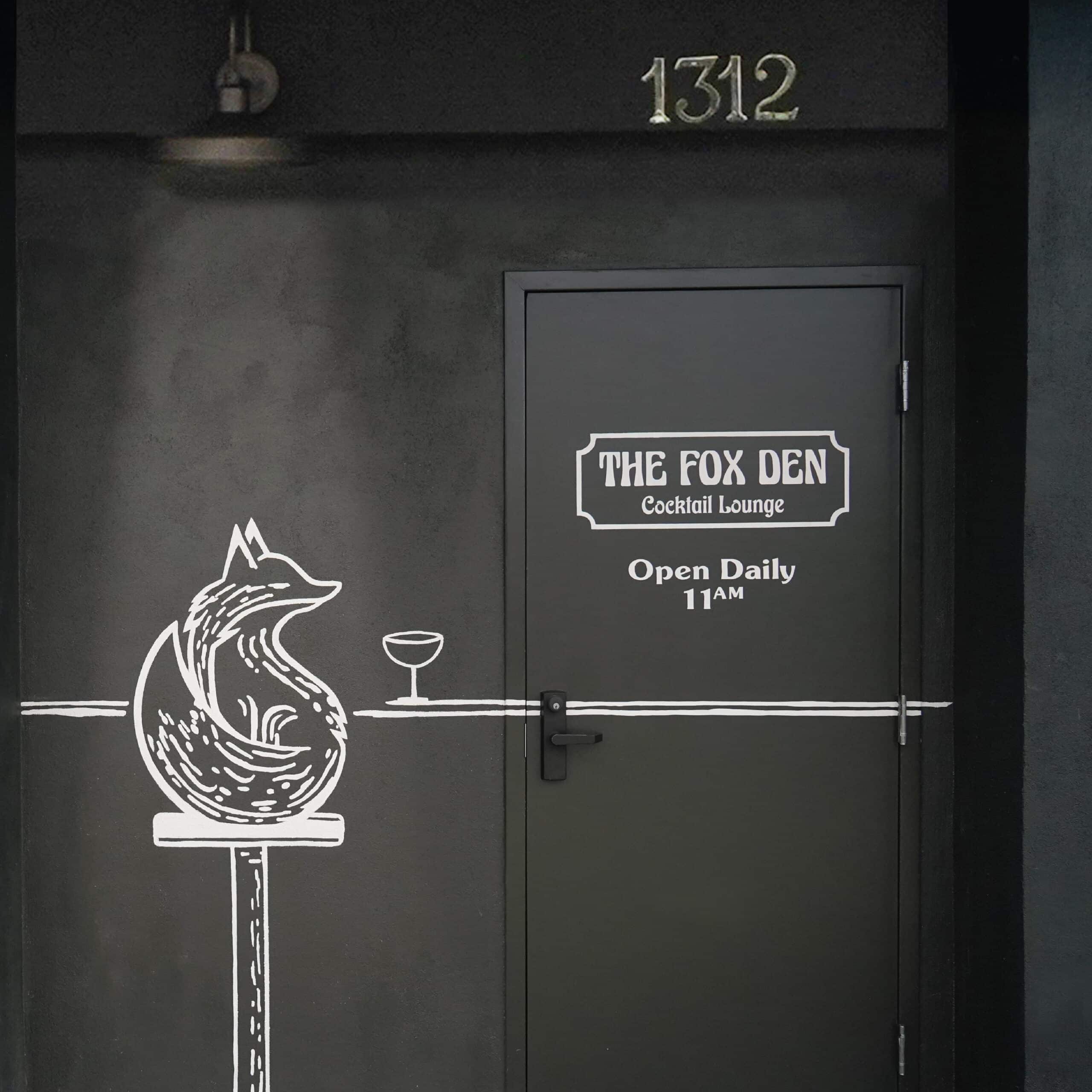 Entrance to The Fox Den cocktail bar in Redondo Beach featuring a custom mural of a fox with a martini, a memorable piece of their hospitality branding designed by Stellen Design.